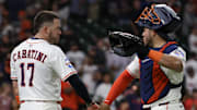 Aug 13, 2025; Houston, Texas, USA; Houston Astros designated hitter Victor Caratini (17) and Houston Astros catcher Yainer Diaz (21) celebrate after defeating the Boston Red Sox at Daikin Park. 