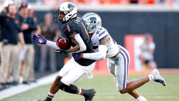 Oklahoma State's Tay Martin (1) is tackled by Kansas State's Julius Brents (23) in the second quarter during the college football game between the Oklahoma State University Cowboys (OSU) and the Kansas State University Wildcats at Boone Pickens Stadium in Stillwater, Okla., Saturday, Sept. 25, 2021. OSU won 31-20.

Osu Vs Kstate