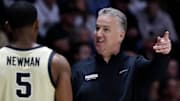 Purdue Boilermakers head coach Matt Painter talks to guard Brandon Newman