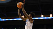 Nov 3, 2025; Los Angeles, California, USA;  UCLA Bruins guard Donovan Dent (2) shoots a three point basket during the first half against the Eastern Washington Eagles at Pauley Pavilion presented by Wescom Financial. Mandatory Credit: Kiyoshi Mio-Imagn Images