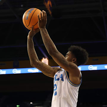 Nov 3, 2025; Los Angeles, California, USA;  UCLA Bruins guard Donovan Dent (2) shoots a three point basket during the first half against the Eastern Washington Eagles at Pauley Pavilion presented by Wescom Financial. Mandatory Credit: Kiyoshi Mio-Imagn Images