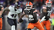 Cleveland Browns quarterback Shedeur Sanders (12) scrambles for yards during the second half of an NFL football game against the Baltimore Ravens at Huntington Bank Field, Nov. 16, 2025, in Cleveland, Ohio.