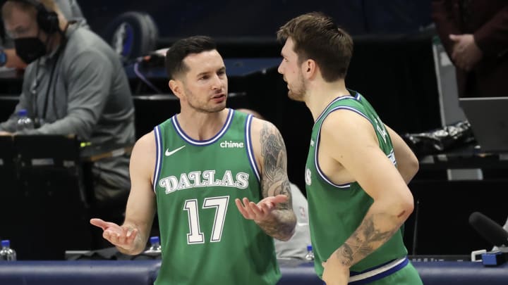 Apr 16, 2021; Dallas, Texas, USA;  Dallas Mavericks guard JJ Redick (17) speaks with guard Luka Doncic (77) during the second quarter against the New York Knicks at American Airlines Center. Mandatory Credit: Kevin Jairaj-USA TODAY Sports