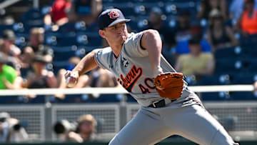 Jun 20, 2022; Omaha, NE, USA;  Auburn Tigers pitcher Blake Burkhalter (40) pitches against the Stanford Cardinal in the ninth inning at Charles Schwab Field. Mandatory Credit: Steven Branscombe-Imagn Images