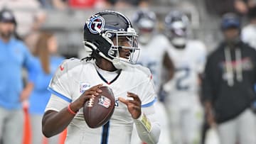 Oct 5, 2025; Glendale, Arizona, USA; Tennessee Titans quarterback Cam Ward (1) looks to throw against the Arizona Cardinals during the fourth quarter at State Farm Stadium. Mandatory Credit: Matt Kartozian-Imagn Images