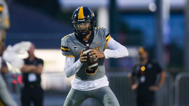American Heritage Patriots quarterback Dia Bell (3) scrambles in the backfield during the first quarter of a game against the Naples Golden Eagles at Staver Field in Naples on Friday, Sept. 13, 2024.