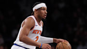 Apr 13, 2025; Brooklyn, New York, USA; New York Knicks guard Miles McBride (2) dribbles up court during the first half against the Brooklyn Nets at Barclays Center. Mandatory Credit: Vincent Carchietta-Imagn Images