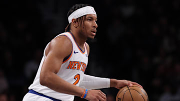 Apr 13, 2025; Brooklyn, New York, USA; New York Knicks guard Miles McBride (2) dribbles up court during the first half against the Brooklyn Nets at Barclays Center. Mandatory Credit: Vincent Carchietta-Imagn Images