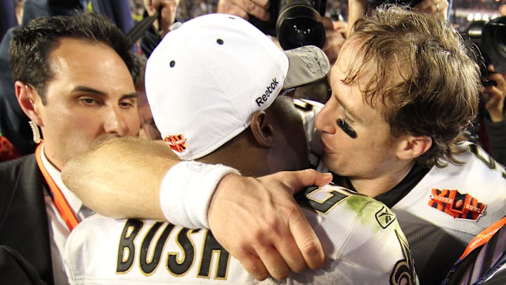 Feb 7, 2010; Miami, FL, USA; New Orleans Saints quarterback Drew Brees (9) hugs running back Reggie Bush (25) after Super Bowl XLIV against the Indianapolis Colts at Sun Life Stadium. The Saints won 31-17. Mandatory Credit: John David Mercer-Imagn Images Feb 7, 2010; Miami, FL, USA; New Orleans Saints quarterback Drew Brees (9) hugs running back Reggie Bush (25) after Super Bowl XLIV against the Indianapolis Colts at Sun Life Stadium. The Saints won 31-17. Mandatory Credit: John David Mercer-Imagn Images