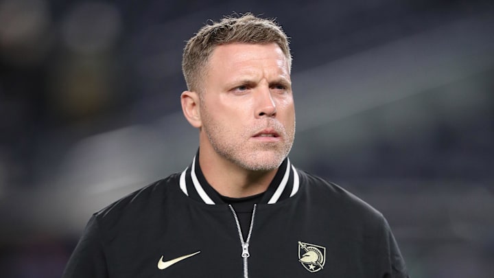 Nov 23, 2024; New York, New York, USA; Army Black Knights assistant coach Mike Viti walks the field before a game against the Notre Dame Fighting Irish at Yankee Stadium. Mandatory Credit: Danny Wild-Imagn Images