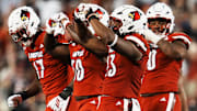 Louisville Cardinals defensive lineman Wesley Bailey (23) makes a heart gesture after his sack against James Madison University in the Card's football game Friday September 5, 2025 at L&N Credit Union Stadium in Louisville, Kentucky. After the game, Bailey said he always does a heart sign after a sack as an honor to his late mother, who was killed when he was five years old. Other Card players have followed his lead.