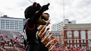 Oct 21, 2023; Cincinnati, Ohio, USA; The Cincinnati Bearcats mascot points to the sky during the playing of the alma mater before the game against the Baylor Bears at Nippert Stadium. Mandatory Credit: Katie Stratman-Imagn Images