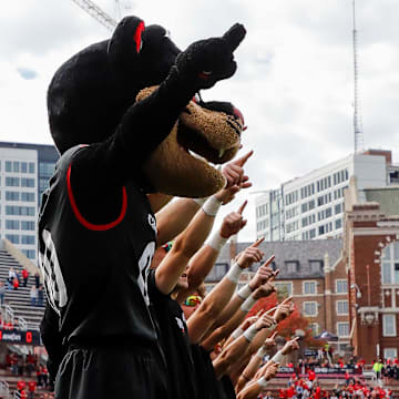 Oct 21, 2023; Cincinnati, Ohio, USA; The Cincinnati Bearcats mascot points to the sky during the playing of the alma mater before the game against the Baylor Bears at Nippert Stadium. Mandatory Credit: Katie Stratman-Imagn Images