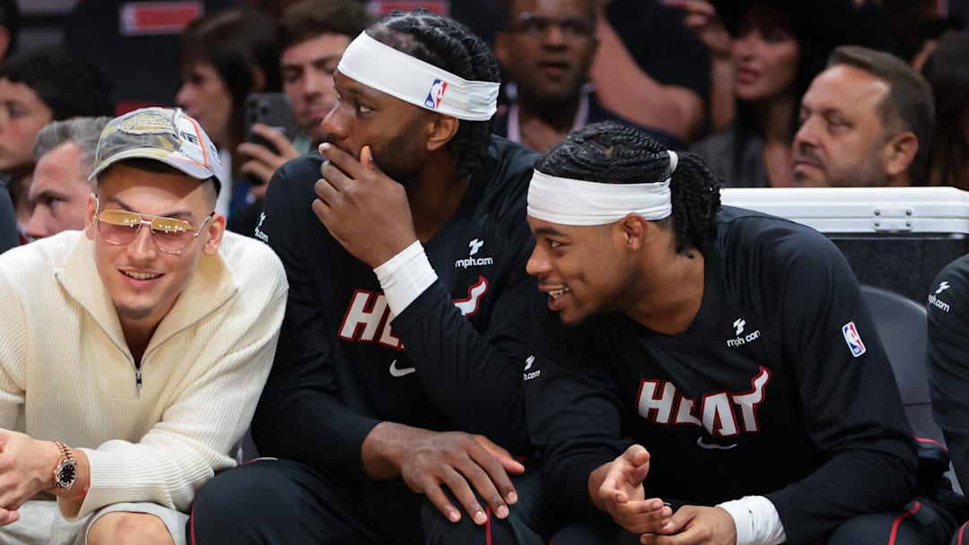 Oct 6, 2025; Miami, Florida, USA; Miami Heat guard Tyler Herro (14) watches from the bench against the Milwaukee Bucks during the first quarter at Kaseya Center. Mandatory Credit: Sam Navarro-Imagn Images