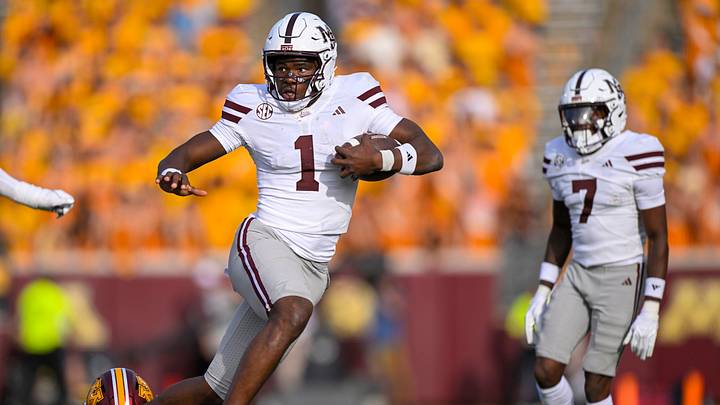 Sep 12, 2026; Minneapolis, Minnesota, USA;  Mississippi State Bulldogs quarterback Kamario Taylor (1) breaks the tackle attempt of Minnesota Golden Gophers defensive back John Nestor (17) during the fourth quarter at Huntington Bank Stadium.  Mandatory Credit: Nick Wosika-Imagn Images