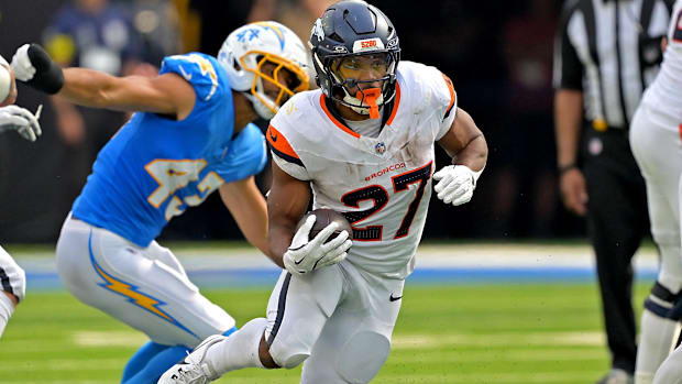 Denver Broncos running back J.K. Dobbins (27) carries the ball in the second half against the Los Angeles Chargers.