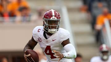 Oct 19, 2024; Knoxville, Tennessee, USA; Alabama Crimson Tide quarterback Jalen Milroe (4) scrambles against the Tennessee Volunteers during the second quarter at Neyland Stadium. Mandatory Credit: Randy Sartin-Imagn Images
