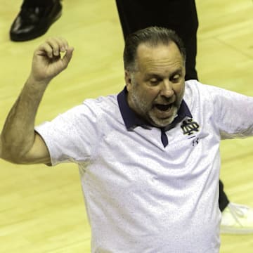 Dec 21, 2022; Tallahassee, Florida, USA; Notre Dame head coach Mike Brey talks to team members during the first half against the Florida State Seminoles at Donald L. Tucker Center. 