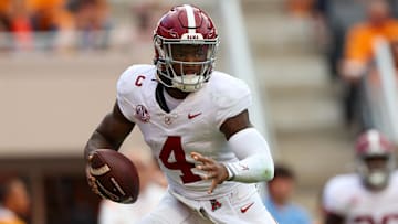Oct 19, 2024; Knoxville, Tennessee, USA; Alabama Crimson Tide quarterback Jalen Milroe (4) scrambles against the Tennessee Volunteers during the second quarter at Neyland Stadium. Mandatory Credit: Randy Sartin-Imagn Images