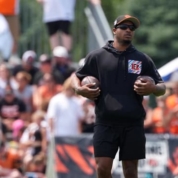 Jul 26, 2024; Cincinnati, OH, USA; Cincinnati Bengals wide receiver Ja'Marr Chase (middle) observes practice during training camp practice at Kettering Health Practice Fields. Mandatory Credit: Kareem Elgazzar-USA TODAY Sports