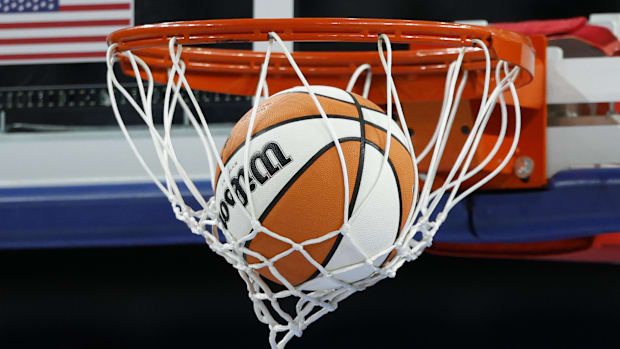 Wilson basketball is seen next to WNBA logo before a game between the Chicago Sky and Phoenix Mercury at Wintrust Arena. 