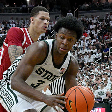 Michigan State Spartans forward Cameron Ward (3) works the baseline under pressure from Arkansas Razorbacks forward Trevon Brazile (7) during the second half at Jack Breslin Student Events Center. 