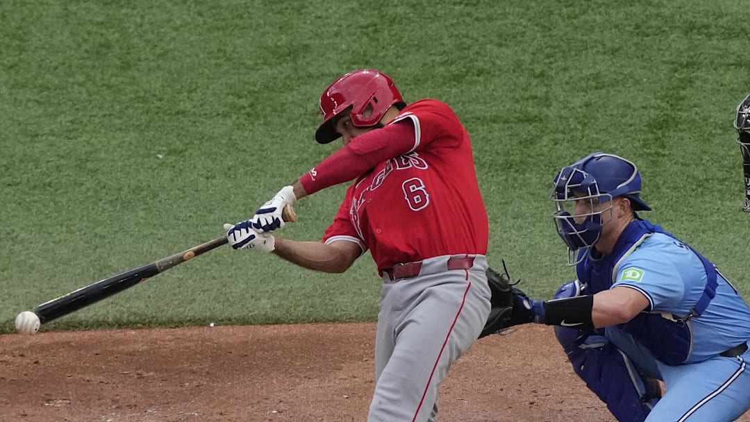 Aug 24, 2024; Toronto, Ontario, CAN; Los Angeles Angels third baseman Anthony Rendon (6) makes contact with a ball against the Toronto Blue Jays during the seventh inning at Rogers Centre. Mandatory Credit: John E. Sokolowski-Imagn Images