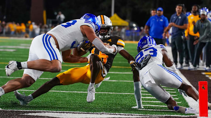 Sep 14, 2024; Laramie, Wyoming, USA; Wyoming Cowboys wide receiver Chris Durr Jr. (15) runs against the Brigham Young Cougars during the fourth quarter at Jonah Field at War Memorial Stadium.