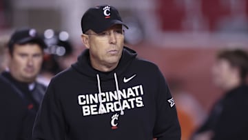 Nov 1, 2025; Salt Lake City, Utah, USA; Cincinnati Bearcats head coach Scott Satterfield watches the teams warm up before the game against the Utah Utes at Rice-Eccles Stadium. Mandatory Credit: Rob Gray-Imagn Images