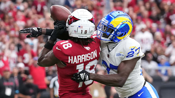 Sep 15, 2024; Glendale, Arizona, USA; Arizona Cardinals wide receiver Marvin Harrison Jr. (18) catches a touchdown pass against Los Angeles Rams cornerback Tre'Davious White (27) during the first half at State Farm Stadium. Mandatory Credit: Joe Camporeale-Imagn Images