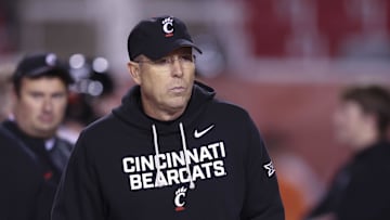 Nov 1, 2025; Salt Lake City, Utah, USA; Cincinnati Bearcats head coach Scott Satterfield watches the teams warm up before the game against the Utah Utes at Rice-Eccles Stadium. Mandatory Credit: Rob Gray-Imagn Images