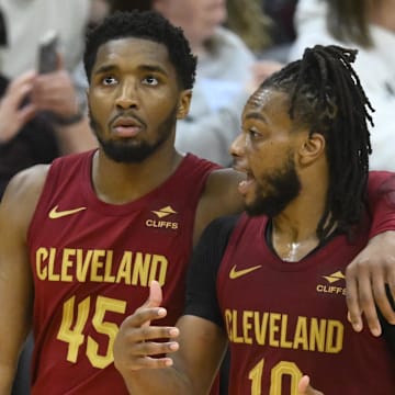 Apr 12, 2024; Cleveland, Ohio, USA; Cleveland Cavaliers guard Donovan Mitchell (45) and guard Darius Garland (10) talk in the fourth quarter against the Indiana Pacers at Rocket Mortgage FieldHouse. Mandatory Credit: David Richard-Imagn Images