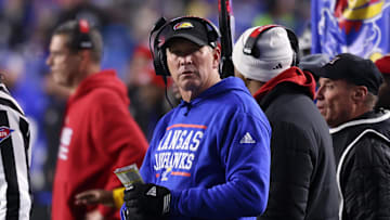 Nov 16, 2024; Provo, Utah, USA; Kansas Jayhawks head coach Lance Leipold checks the scoreboard against the Brigham Young Cougars during the second quarter at LaVell Edwards Stadium. Mandatory Credit: Rob Gray-Imagn Images