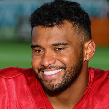 Miami Dolphins quarterback Tua Tagovailoa (1) reacts while talking to reporters during an interview after training camp at Baptist Health Training Complex.