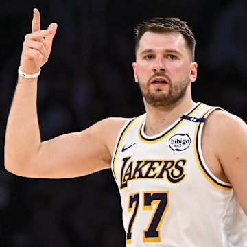 Mar 22, 2025; Los Angeles, California, USA; Los Angeles Lakers guard Luka Doncic (77) reacts after scoring against Chicago Bulls during the first half at Crypto.com Arena. Mandatory Credit: Jonathan Hui-Imagn Images