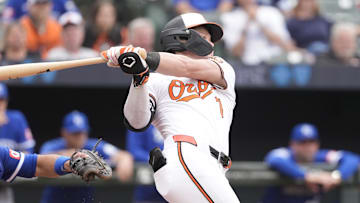 May 4, 2025; Baltimore, Maryland, USA; Baltimore Orioles second baseman Jackson Holliday (7) hits a single against the Kansas City Royals during the eighth inning at Oriole Park at Camden Yards