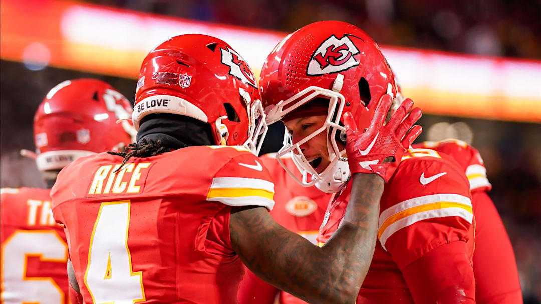 Jan 13, 2024; Kansas City, Missouri, USA; Kansas City Chiefs quarterback Patrick Mahomes (15) celebrates with wide receiver Rashee Rice (4) during the first half of a 2024 AFC wild card game against the Miami Dolphins at GEHA Field at Arrowhead Stadium. Mandatory Credit: Jay Biggerstaff-Imagn Images