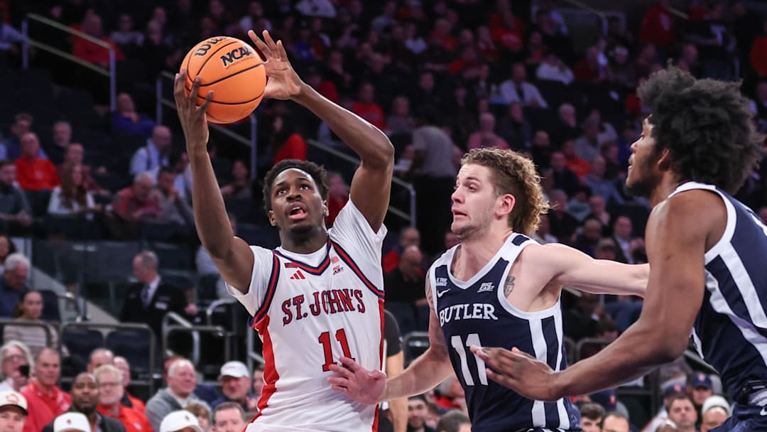 Jan 28, 2026; New York, New York, USA;  St. John's basketball guard Ian Jackson (11) drives past Butler Bulldogs guard Finley Bizjack (11) in the second half at Madison Square Garden.