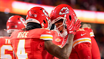 Jan 13, 2024; Kansas City, Missouri, USA; Kansas City Chiefs quarterback Patrick Mahomes (15) celebrates with wide receiver Rashee Rice (4) during the first half of a 2024 AFC wild card game against the Miami Dolphins at GEHA Field at Arrowhead Stadium. Mandatory Credit: Jay Biggerstaff-Imagn Images