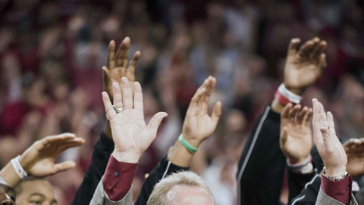 Jan 21, 2012; Fayetteville, AR, USA; Arkansas Razorbacks head coach Bobby Petrino calls the hogs during half time of a basketball game between the Michigan Wolverines and Arkansas Razorbacks at Bud Walton Arena. The football team was honor for winning the 2012 AT&T Cotton Bowl Classic. Arkansas defeated Michigan 66-64. Mandatory Credit: Beth Hall-USA TODAY Sports