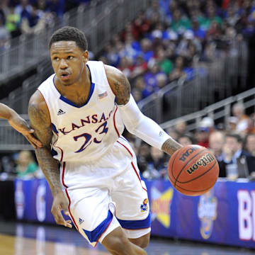 Mar 16, 2013; Kansas City, MO, USA; Kansas Jayhawks guard Ben McLemore (23) drives to the basket against the Kansas State Wildcats in the second half during the championship game of the Big 12 tournament at the Sprint Center. Kansas defeated Kansas State 70-54. Mandatory Credit: Peter G. Aiken-Imagn Images
