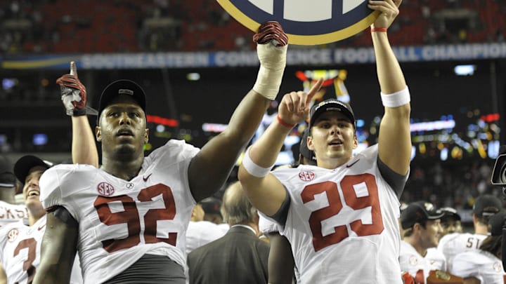 Dec 1, 2012; Atlanta, GA, USA; Alabama Crimson Tide defensive lineman Damion Square (92) and punter Cody Mandell (29) celebrate after defeating the Georgia Bulldogs 32-28 in the 2012 SEC Championship game at the Georgia Dome. Mandatory Credit:  Dale Zanine-Imagn Images