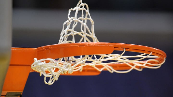 Aug 16, 2011; Los Angeles CA, USA; General view of a WNBA basketball going through the rim and the net before the game between the Atlanta Dream and the Los Angeles Sparks. Mandatory Credit: Kirby Lee/Image of Sport-Imagn Images