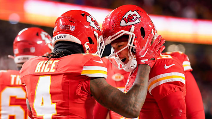 Jan 13, 2024; Kansas City, Missouri, USA; Kansas City Chiefs quarterback Patrick Mahomes (15) celebrates with wide receiver Rashee Rice (4) during the first half of a 2024 AFC wild card game against the Miami Dolphins at GEHA Field at Arrowhead Stadium. Mandatory Credit: Jay Biggerstaff-Imagn Images