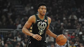 Mar 22, 2019; Milwaukee, WI, USA; Milwaukee Bucks forward Giannis Antetokoumpo (34) brings the ball up the court against the Miami Heat at Fiserv Forum. Mandatory Credit: Michael McLoone-Imagn Images