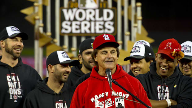 St. Louis Cardinals manager Tony La Russa addresses the crowd during the 2011 World Series victory celebration and parade