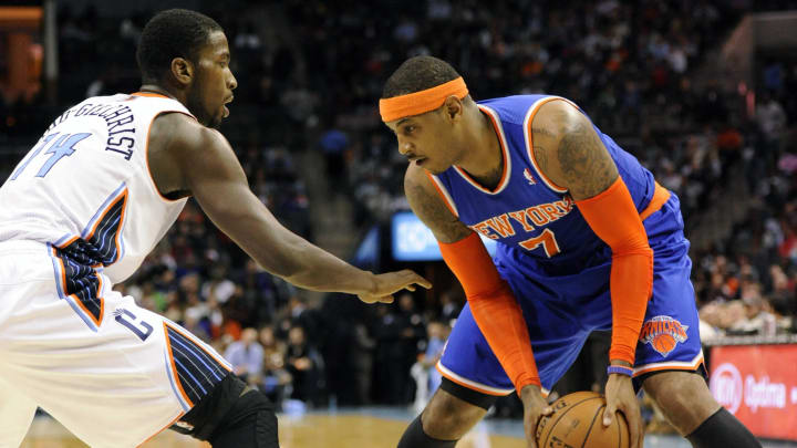 Nov 8, 2013; Charlotte, NC, USA; New York Knicks forward Carmelo Anthony (7) looks to drive past Charlotte Bobcats forward Michael Kidd-Gilchrist (14) during the game at Time Warner Cable Arena. Mandatory Credit: Sam Sharpe-USA TODAY Sports