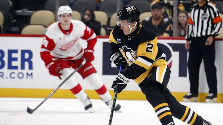 Oct 1, 2024; Pittsburgh, Pennsylvania, USA;  Pittsburgh Penguins right wing Rutger McGroarty (2) handles the puck against the Detroit Red Wings during the second period at PPG Paints Arena. Mandatory Credit: Charles LeClaire-Imagn Images