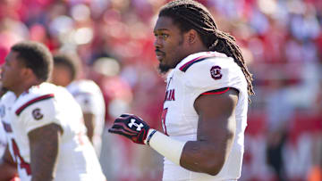 Oct 12, 2013; Fayetteville, AR, USA; South Carolina Gamecock defensive end Jadeveon Clowney (7) stretches before a game against the Arkansas Razorbacks at Donald W. Reynolds Razorback Stadium. South Carolina defeated Arkansas 52-7. Mandatory Credit: Beth Hall-Imagn Images