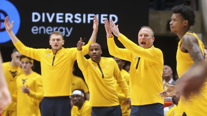 Jan 7, 2025; Morgantown, West Virginia, USA; West Virginia Mountaineers head coach Darian DeVries argues a call during the first half against the Arizona Wildcats at WVU Coliseum. Mandatory Credit: Ben Queen-Imagn Images